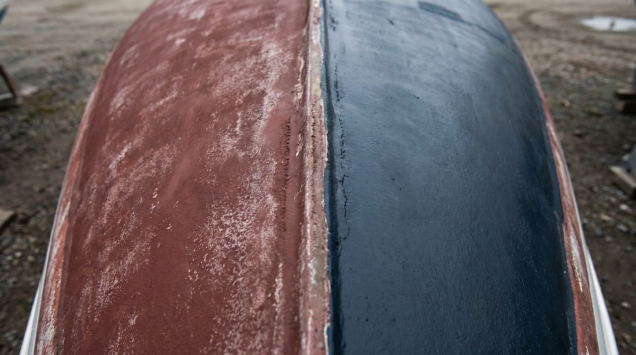 close-up of hull bottom showing ablative and hard antifouling surface texture side by side
