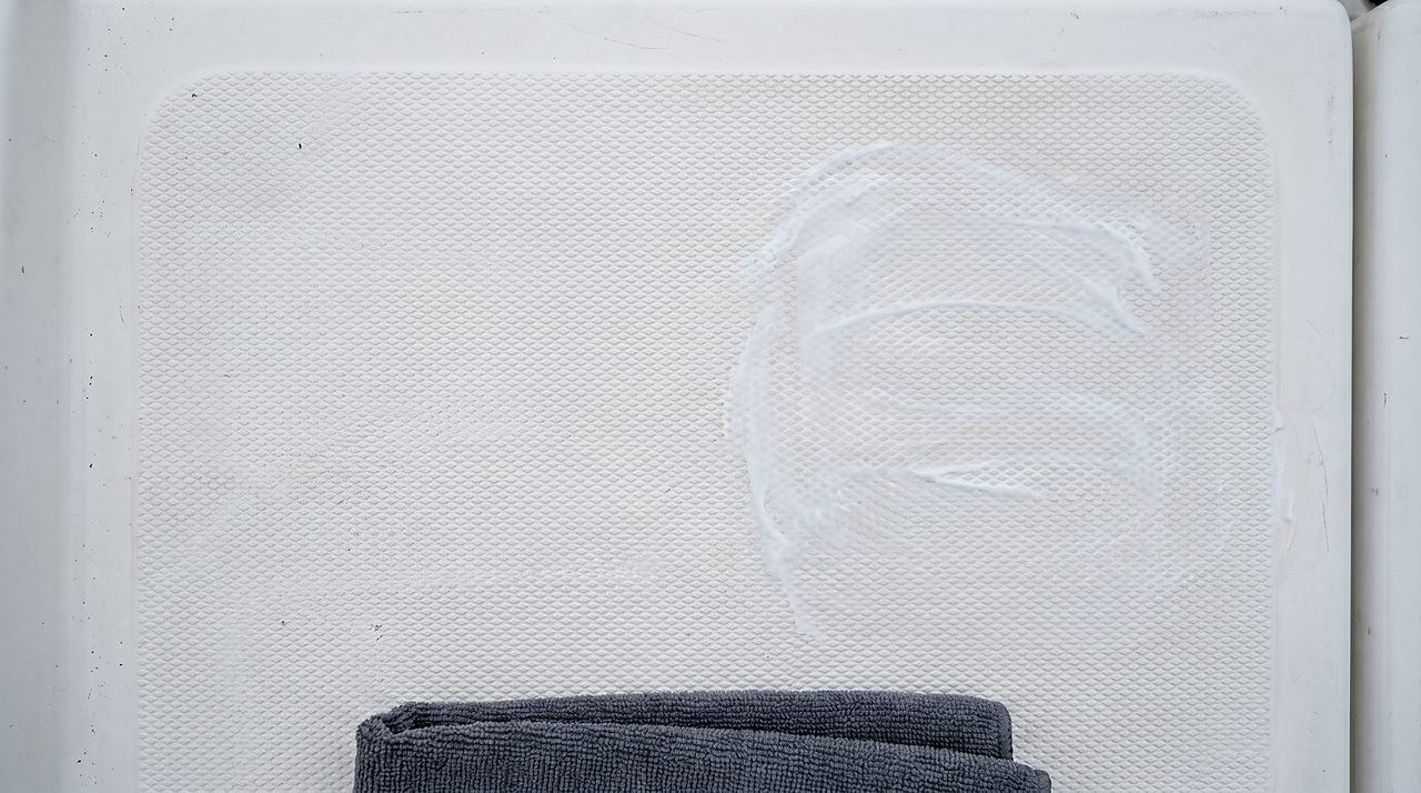 standard wax accidentally applied to non-skid deck texture, showing filled surface pattern