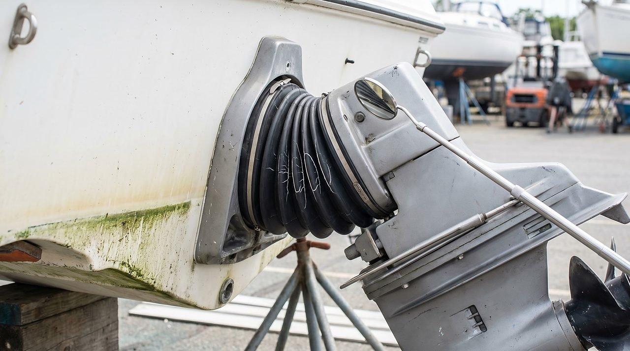 sterndrive bellows showing early stress cracking at the transom gimbal ring during a boatyard inspection